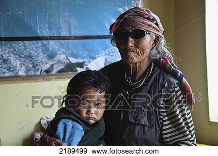 Old Tibetan Woman And Grandchild In Tibetan Refugee Colony In Leh, Ladhak, India View Large Photo Image Stock Photo - Old Tibetan Woman And Grandchild In Tibetan Refugee Colony In Leh, Ladhak, India. Fotosearch