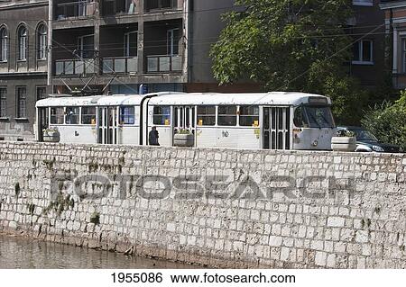 Old Tramway Travelling Along The Miljacka River, Sarajevo, Bosnia And Herzegovina View Large Photo Image Stock Photograph - Old Tramway Travelling Along The Miljacka River, Sarajevo, Bosnia And Herzegovina. Fotosearch