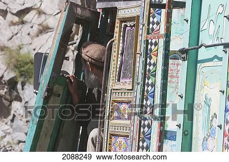 Stock Photo - Old Truck Driver, Dasu, North-West Frontier Province, Pakistan. Fotosearch
