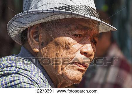 Stock Image - Old woman at the Bolu market, Rantepao, Toraja Land, South Sulawesi, Indonesia. Fotosearch