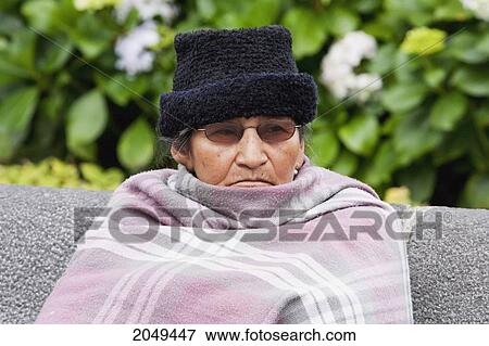 Stock Photo - Old Woman Sitting On A Bench On Plaza Grande, Quito, Pichincha, Ecuador. Fotosearch