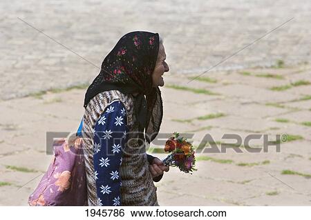Old woman with flower bouquet, Sofia, Bulgaria View Large Photo Image Stock Photograph - Old woman with flower bouquet, Sofia, Bulgaria. Fotosearch