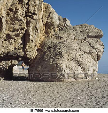 Stock Photography - Olympos Beach, Male Tourist Under Rock Bridge. Fotosearch