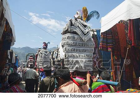 Stock Image - On Easter Sunday The Comrades (Council Men) Carry The Andas (Floats) Of The Saints In Procession Through The Streets Of Chichicastenango, El Quich. Fotosearch