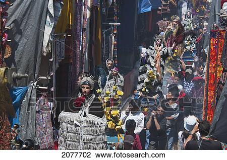 Stock Image - On Easter Sunday The Comrades (Council Men) Carry The Andas (Floats) Of The Saints In Procession Through The Streets Of Chichicastenango, El Quich. Fotosearch