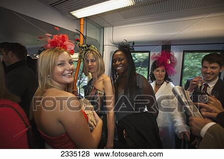 Stock Photo - On Train For Royal Ascot And Lady's Day; England, Uk. Fotosearch