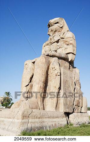 Stock Photo - One Of The Colossi Of Memnon (Two Massive Stone Statues Of Pharaoh Amenhotep Iii), Western Thebes, Qina, Egypt. Fotosearch