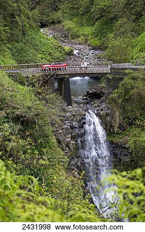 One of the many historic bridges and waterfalls on the famous road to Hana; Maui, Hawaii, United States of America View Large Photo Image Stock Photo - One of the many historic bridges and waterfalls on the famous road to Hana; Maui, Hawaii, United States of America. Fotosearch
