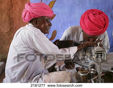 Opium Ceremony In Rural Desert Village Near Jodhpur Rajasthan India View Large Photo Image Stock Photo - Opium Ceremony In Rural Desert Village Near Jodhpur Rajasthan India. Fotosearch