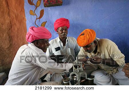 Stock Photo - Opium Ceremony In Rural Desert Village Near Jodhpur Rajasthan India. Fotosearch