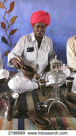 Stock Photo - Opium Ceremony In Rural Desert Village Near Jodhpur Rajasthan India. Fotosearch