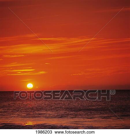 Orange Sunset Over Ocean Water, Sunball On Horizon. View Large Photo Image Stock Image - Orange Sunset Over Ocean Water, Sunball On Horizon.. Fotosearch