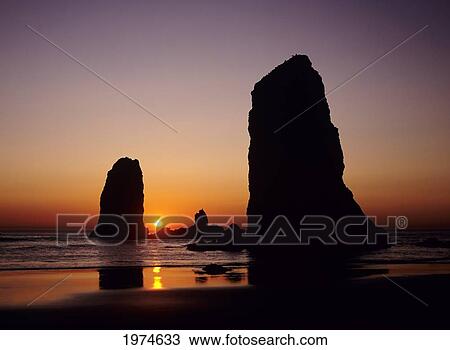 Stock Image - Oregon, Cannon Beach, Sea Stacks Near Haystack Rock At Sunset.. Fotosearch