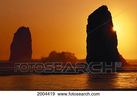 Stock Photo - Oregon Coast, Sunset Over Sea Stacks At Cannon Beach. Fotosearch