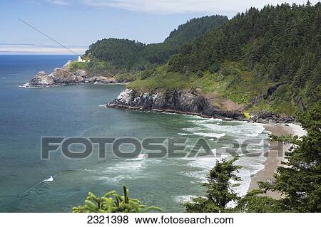 Oregon, Southern Coast, Coastal View With Umpqua Lightouse In The Distance. View Large Photo Image Stock Photo - Oregon, Southern Coast, Coastal View With Umpqua Lightouse In The Distance.. Fotosearch