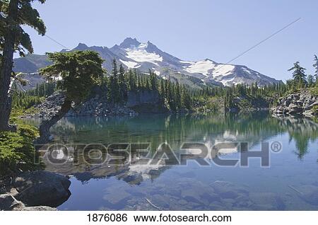 Stock Photograph - Oregon, United States Of America; Reflection Of Mt. Jefferson In Bays Lake. Fotosearch