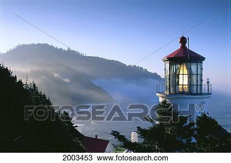 Oregon, View Of Heceta Head Lighthouse Early Morning Sun, Tree Covered Mountains View Large Photo Image Stock Image - Oregon, View Of Heceta Head Lighthouse Early Morning Sun, Tree Covered Mountains. Fotosearch