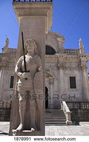 Stock Image - Orlando Column In Front Of St Blaise's Church. Fotosearch