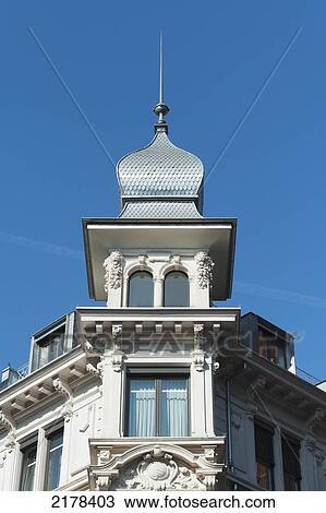 Stock Image - Ornate Facade And Architectural Detail Of A White Building Against A Blue Sky; Zurich Switzerland. Fotosearch