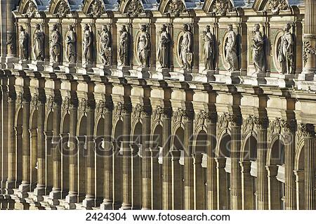 Picture - Ornate facade of a building with columns and statues of men in a row; Paris, France. Fotosearch