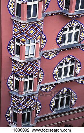 Stock Image - Ornate Pink Building And Windows, Close Up. Fotosearch