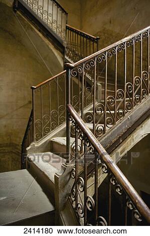 Stock Image - Ornate railing going up a staircase; Barcelona, Spain. Fotosearch