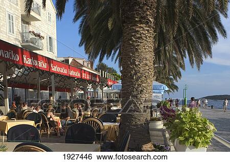 Stock Photograph - Outdoor Cafe Along Seafront In Hvar Town; Hvar, Split-Dalmatia County, Croatia. Fotosearch