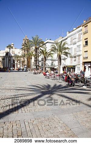 Outdoor Cafe And Palm Trees In A Town Square; Cadiz, Andalusia, Spain View Large Photo Image Stock Photo - Outdoor Cafe And Palm Trees In A Town Square; Cadiz, Andalusia, Spain. Fotosearch