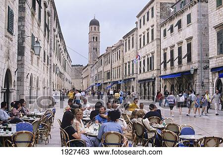 Stock Image - Outdoor Cafes, Placa Main Street. Fotosearch