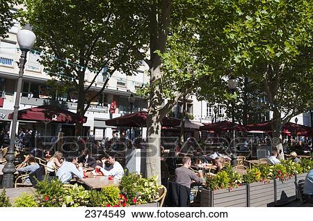 Stock Photo - Outdoor patio seating of a restaurant; Luxembourg. Fotosearch