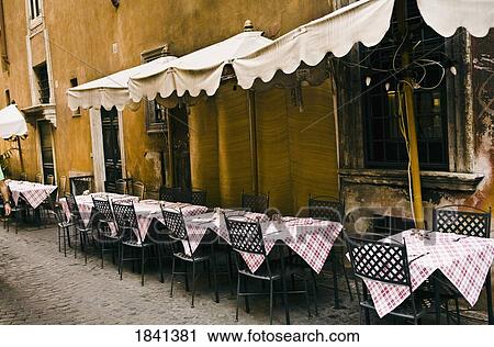 Stock Image - Outdoor Restaurant Without Costumers; Rome, Italy. Fotosearch