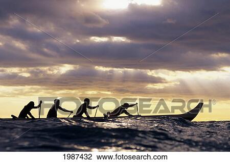 Outrigger Canoe And Paddlers Silhouetted At Sunset, Sunrays Through The Clouds View Large Photo Image Stock Image - Outrigger Canoe And Paddlers Silhouetted At Sunset, Sunrays Through The Clouds. Fotosearch