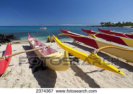 Stock Photo - Outrigger canoes on Kuki'o Beach and Bay; Big Island, Hawaii, United States of America. Fotosearch