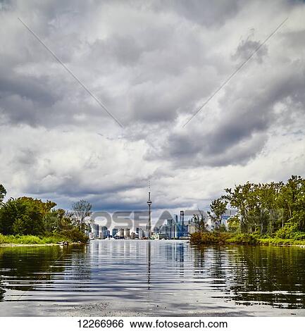 Overcast skyline taken from the Toronto Islands; Toronto, Ontario, Canada View Large Photo Image Stock Photograph - Overcast skyline taken from the Toronto Islands; Toronto, Ontario, Canada. Fotosearch