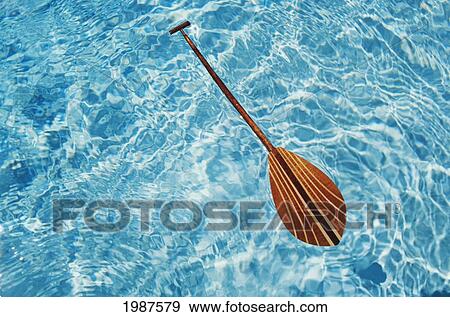 Overhead View Of Paddle Floating On Surface Of Turquoise Water. View Large Photo Image Stock Photo - Overhead View Of Paddle Floating On Surface Of Turquoise Water.. Fotosearch