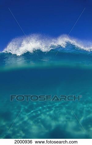 Over/Under Turquoise Ocean With Small Breaking Wave, Clear Blue Sky D1641 View Large Photo Image Stock Photograph - Over/Under Turquoise Ocean With Small Breaking Wave, Clear Blue Sky D1641. Fotosearch