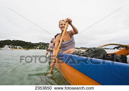Paddling On A Waka In The Bay Of Islands; New Zealand View Large Photo Image Stock Image - Paddling On A Waka In The Bay Of Islands; New Zealand. Fotosearch
