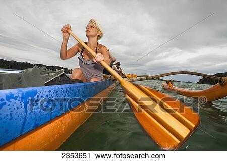 Paddling On A Waka In The Bay Of Islands; New Zealand View Large Photo Image Stock Image - Paddling On A Waka In The Bay Of Islands; New Zealand. Fotosearch