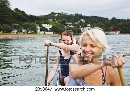 Paddling On A Waka In The Bay Of Islands; New Zealand View Large Photo Image Stock Photo - Paddling On A Waka In The Bay Of Islands; New Zealand. Fotosearch