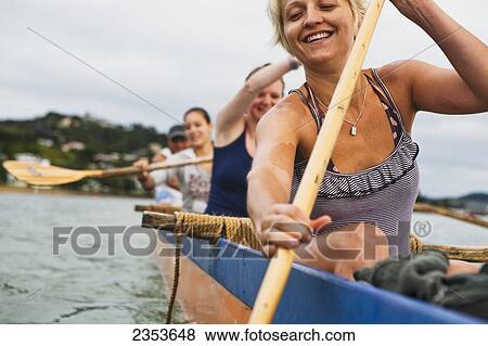 Stock Photo - Paddling On A Waka In The Bay Of Islands; New Zealand. Fotosearch