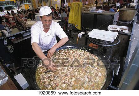 Stock Photo - Paella Being Cooked At A Snack Bar During Feria. Fotosearch