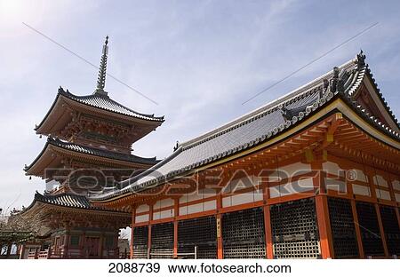 Stock Photo - Pagoda And Red Building; Kyoto, Japan. Fotosearch