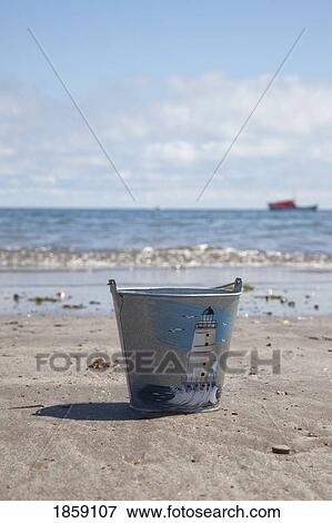 Pail On Beach, Boulmer Beach, Northumberland, England View Large Photo Image Stock Photo - Pail On Beach, Boulmer Beach, Northumberland, England. Fotosearch