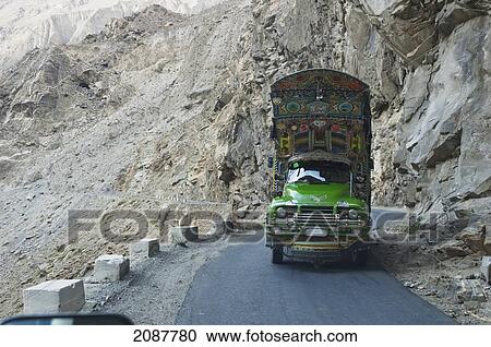 Stock Image - Painted And Decorated Pakistani Truck On Highway S1 Between Skardu And Gilgit In Baltistan, Northern Areas, Pakistan. Fotosearch