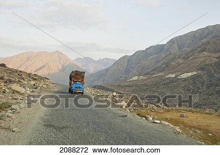 Stock Image - Painted And Decorated Pakistani Truck On The Karakoram Highway Near Chilas, Northern Areas, Pakistan. Fotosearch