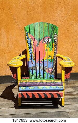 Stock Image - Painted Chair; Island Village Entertainment Complex, Ocho Rios, St. Ann's Parish, Jamaica, Caribbean. Fotosearch