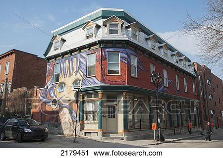 Stock Image - Painting Of A Female On The Wall Of A Building On The Corner; Montreal Quebec Canada. Fotosearch