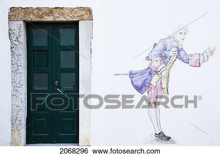 Painting Of An Historical Figure On A White Wall Beside A Door; Faro Algarve Portugal View Large Photo Image Stock Photograph - Painting Of An Historical Figure On A White Wall Beside A Door; Faro Algarve Portugal. Fotosearch