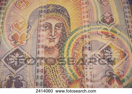 Stock Image - Painting of Mary and Jesus behind net screen, St Mary of Zion Cathedral; Axum, Tigray region, Ethiopia. Fotosearch