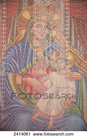 Stock Image - Painting of Mary and Jesus behind net screen, St Mary of Zion Cathedral; Axum, Tigray region, Ethiopia. Fotosearch